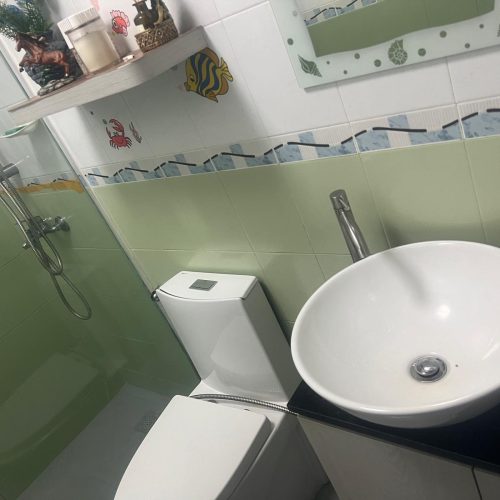 Experienced handyman fixing cabinet doors in HDB flat – Handyman Services Singapore